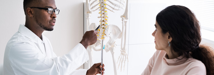 Chiropractic Back Pain Doctor With Patient Chiropractic Back Pain Doctor With Patient