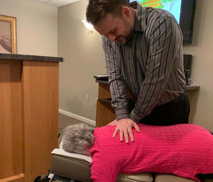 Chiropractor Frederick MD Sebastian Lipinski patient adjust