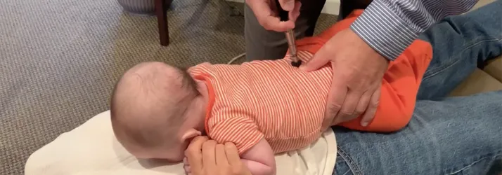 Chiropractor Frederick MD Sebastian Lipinski Adjusting An Infant Chiropractor Frederick MD Sebastian Lipinski Adjusting An Infant
