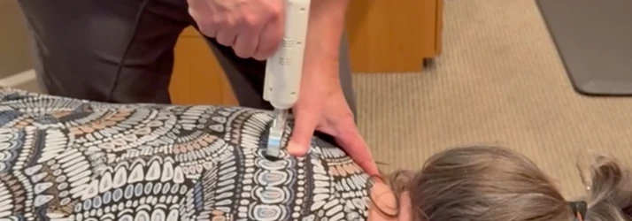 A patient receiving text neck care.
