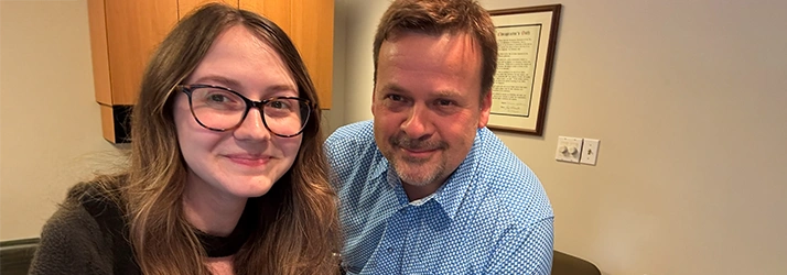 Chiropractor at Lipinski Chiropractic standing with Chloe welcoming you to the office