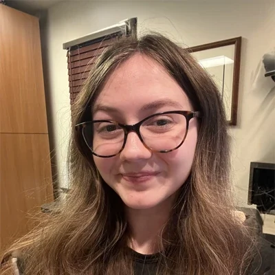 Chiropractic Frederick MD Chloe Chloe smiling with glasses on.